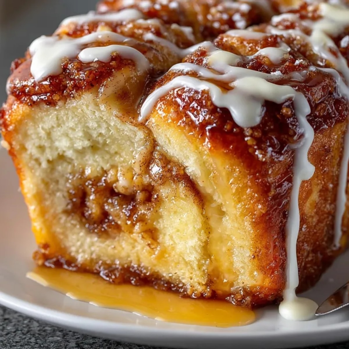 Easy and Fast Cinnamon Twist Loaf fresh from the oven, drizzled with creamy glaze.