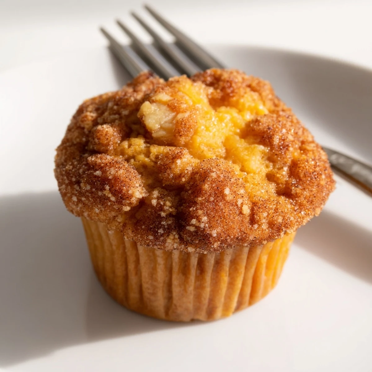 Delicious cheddar pumpkin churro muffins, bursting with flavor and golden-brown sweetness.  