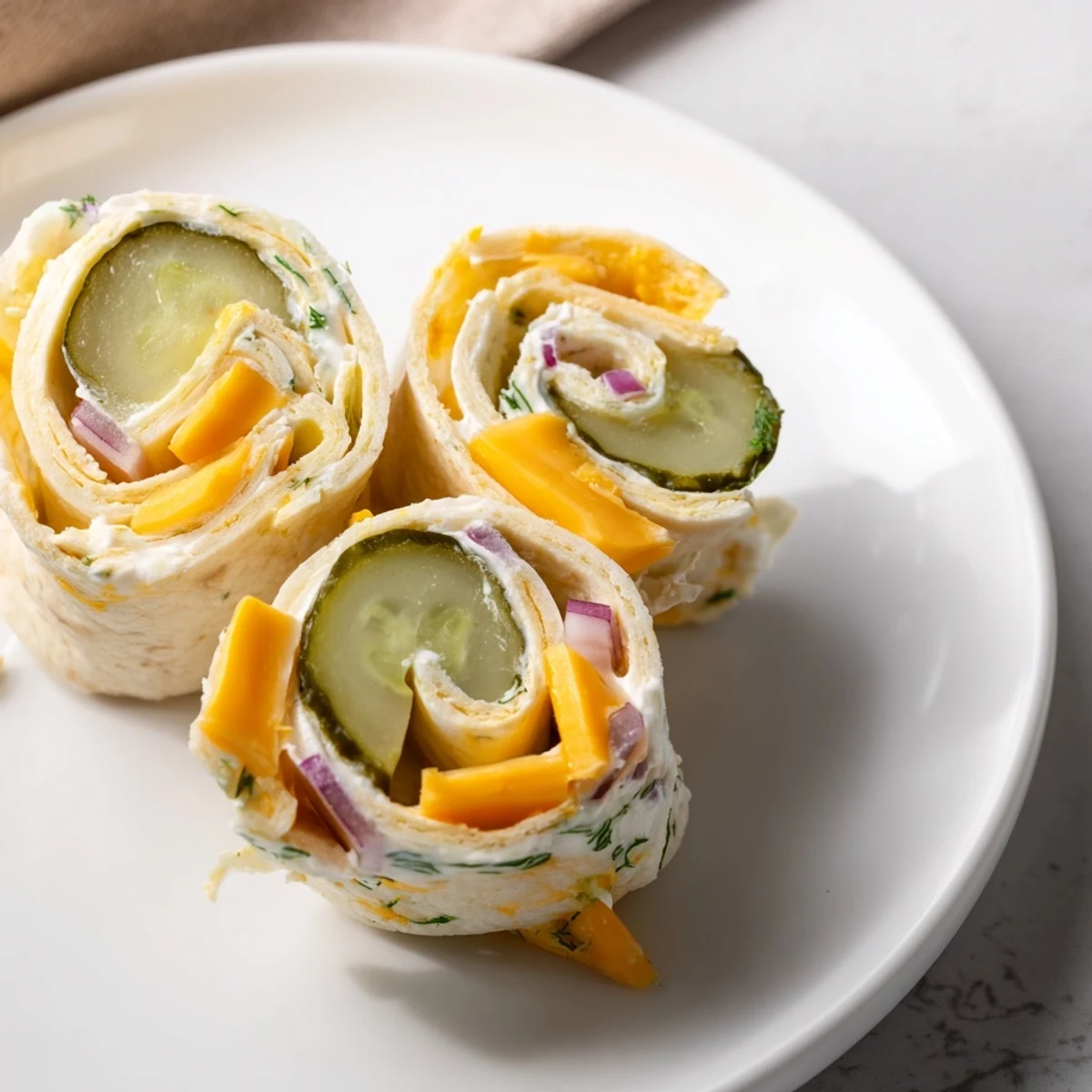 Flavorful Pickle-in-a-Blanket snacks, perfect for parties or quick, tangy bites.  