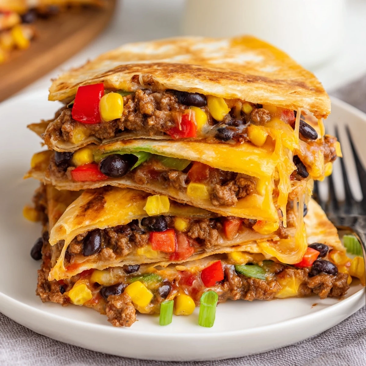 Delicious sheet pan quesadillas filled with seasoned beef and melted cheese, perfect for gatherings.