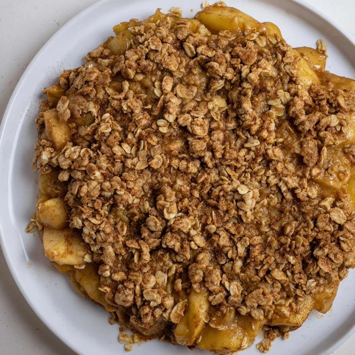 Homemade Apple Crisp: Crispy oat topping over sweet, tender apples, perfect for serving warm.