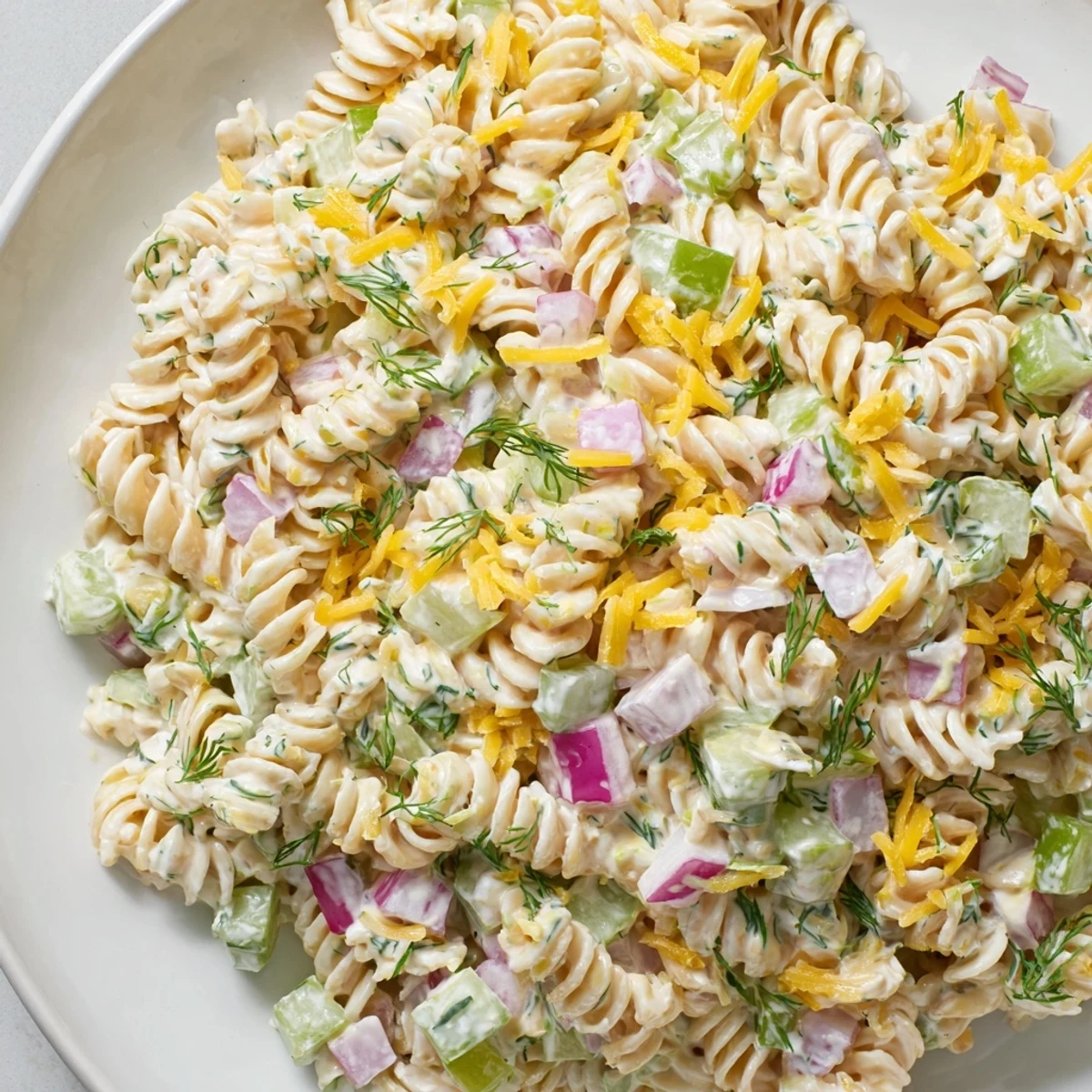 Cool, refreshing Dill Pickle Pasta Salad; a delicious vegetarian picnic salad with creamy dressing.