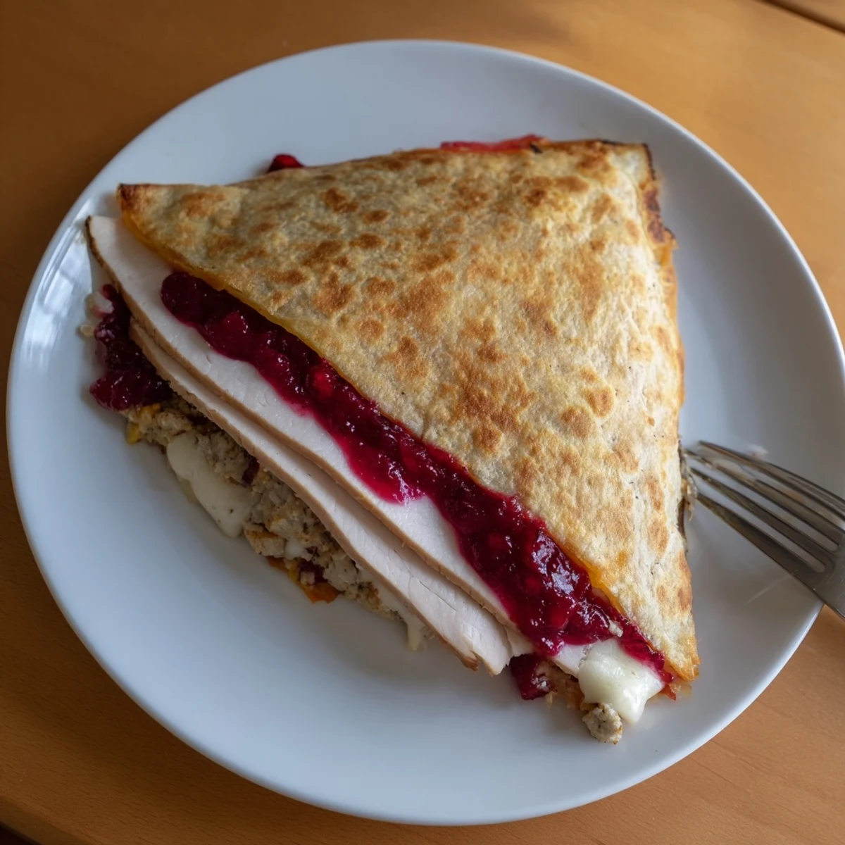 Crispy Turkey, Stuffing & Cranberry Leftovers Tortilla Wrap, golden brown and cheesy.