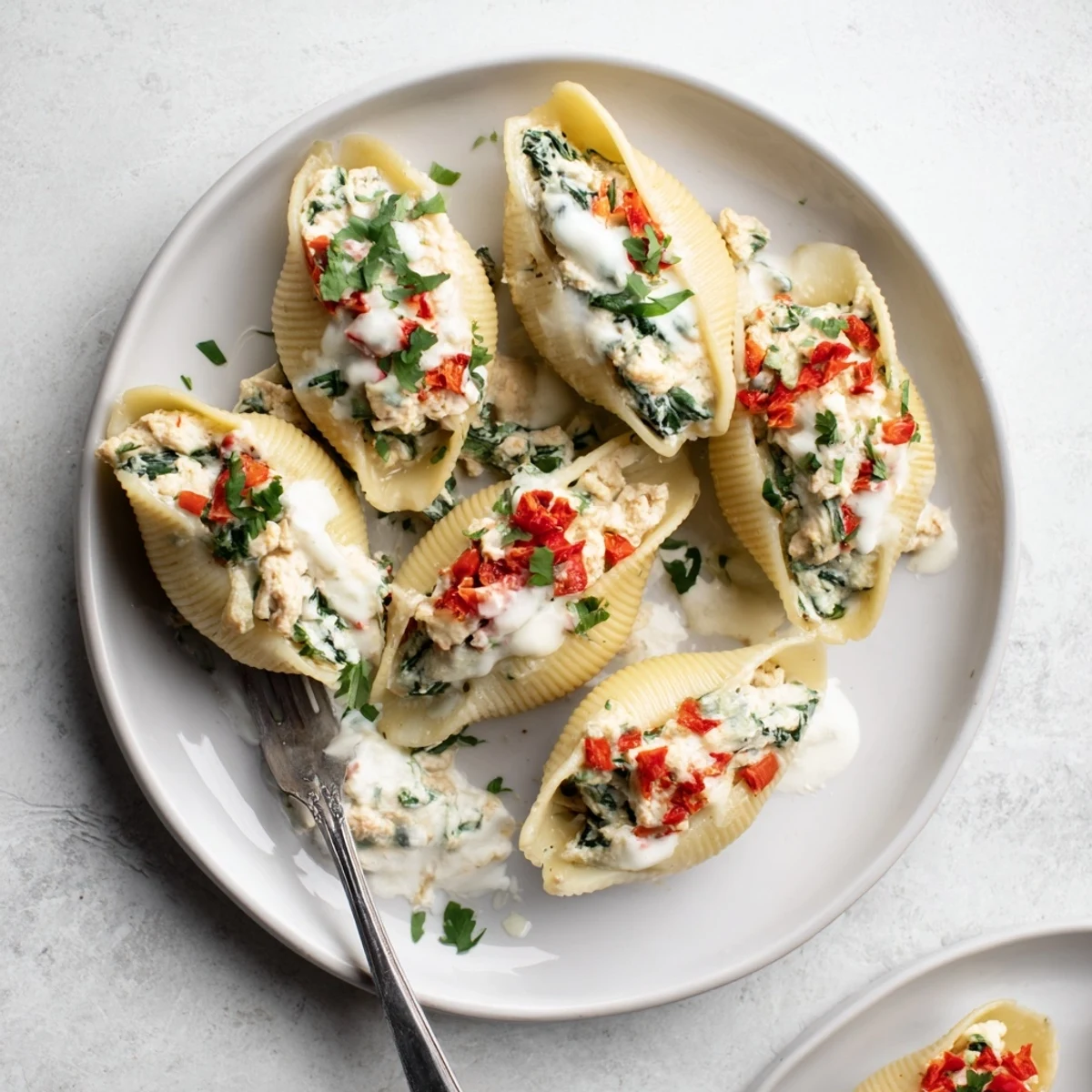 High-Protein Cottage Cheese Alfredo Christmas Shells, baked golden and bubbly with a creamy, rich sauce.