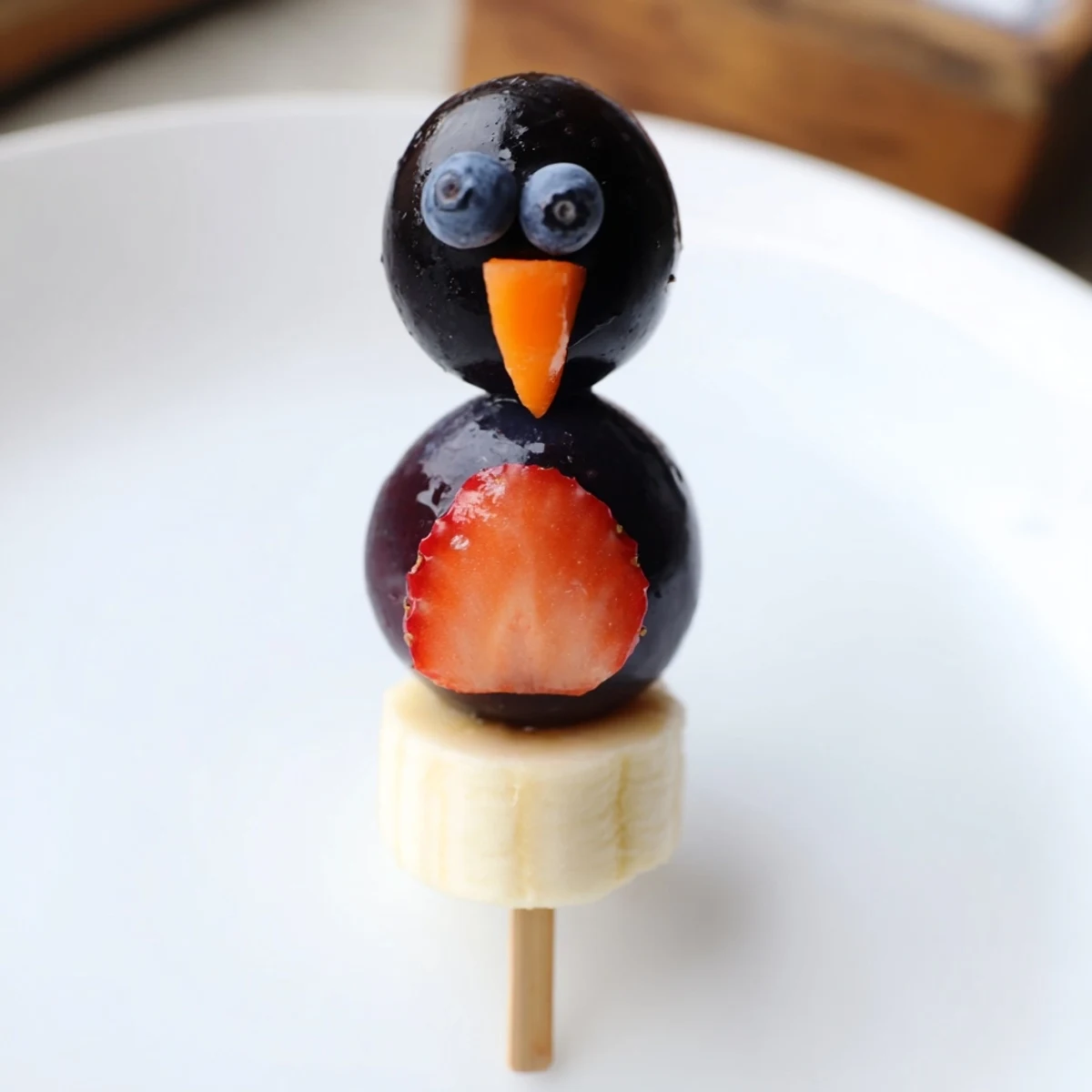 Healthy and delicious Penguin Fruit Skewer Army display, made with colorful fruit, perfect for kids.