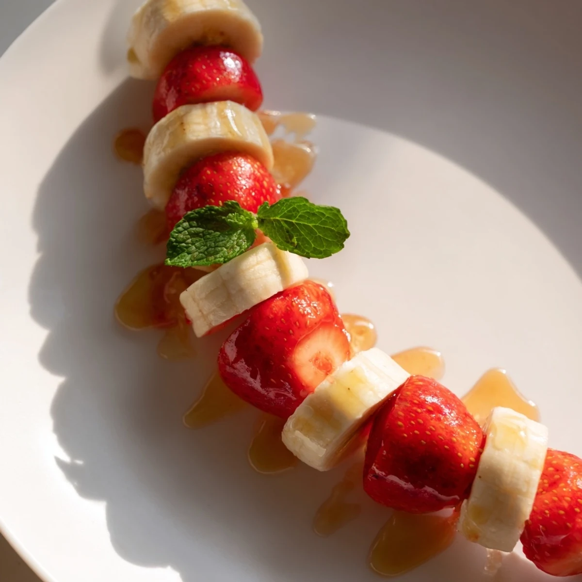 Vibrant banana strawberry candy cane snack, beautifully arranged and ready to enjoy for a healthy treat.