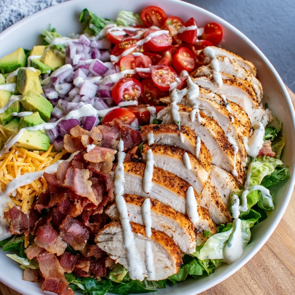 Crispy Bacon Chicken Salad with juicy chicken, crunchy bacon, and creamy ranch dressing on fresh greens.