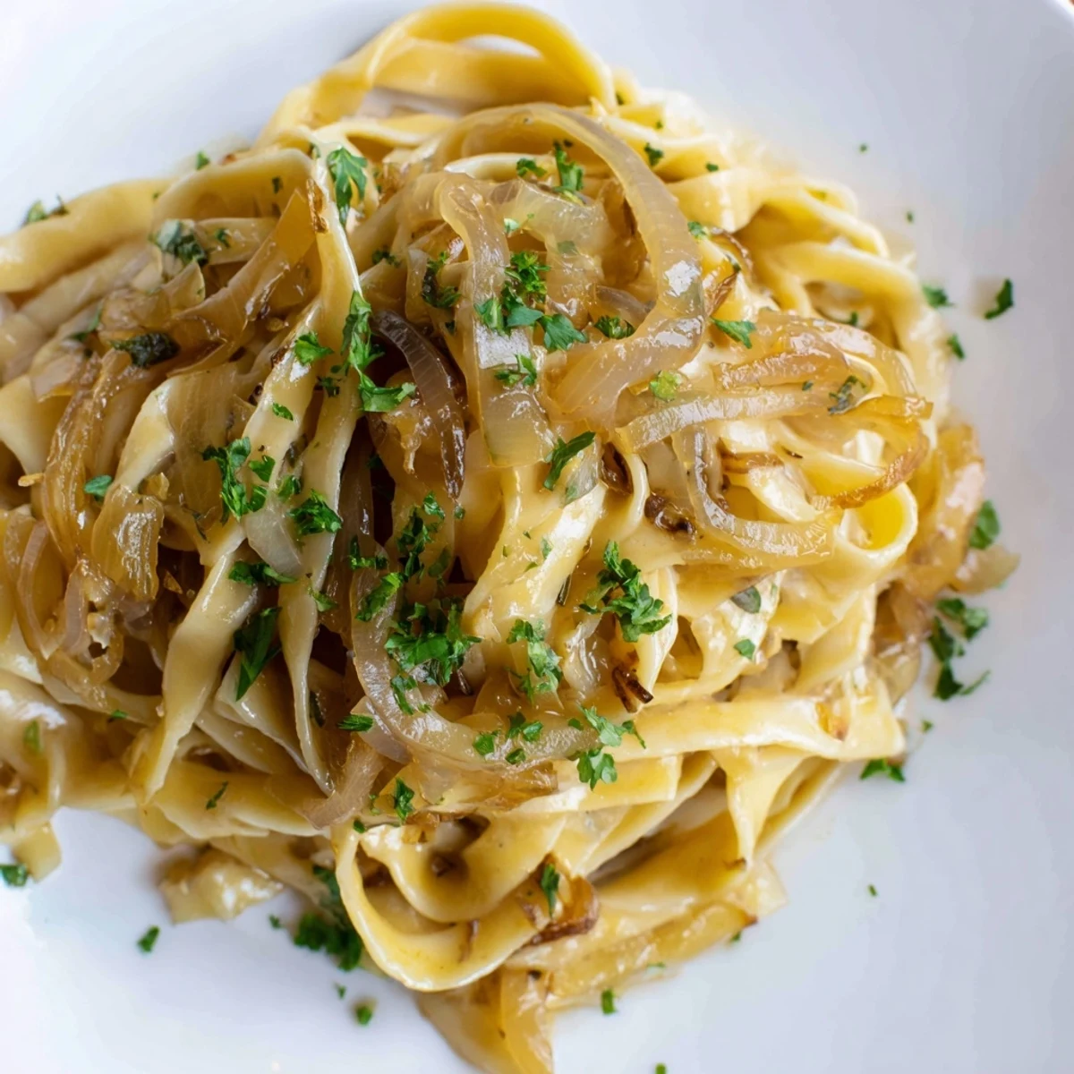 Golden brown caramelized onions and melted Gruyère atop One-Pot French Onion Pasta, a hearty main dish.