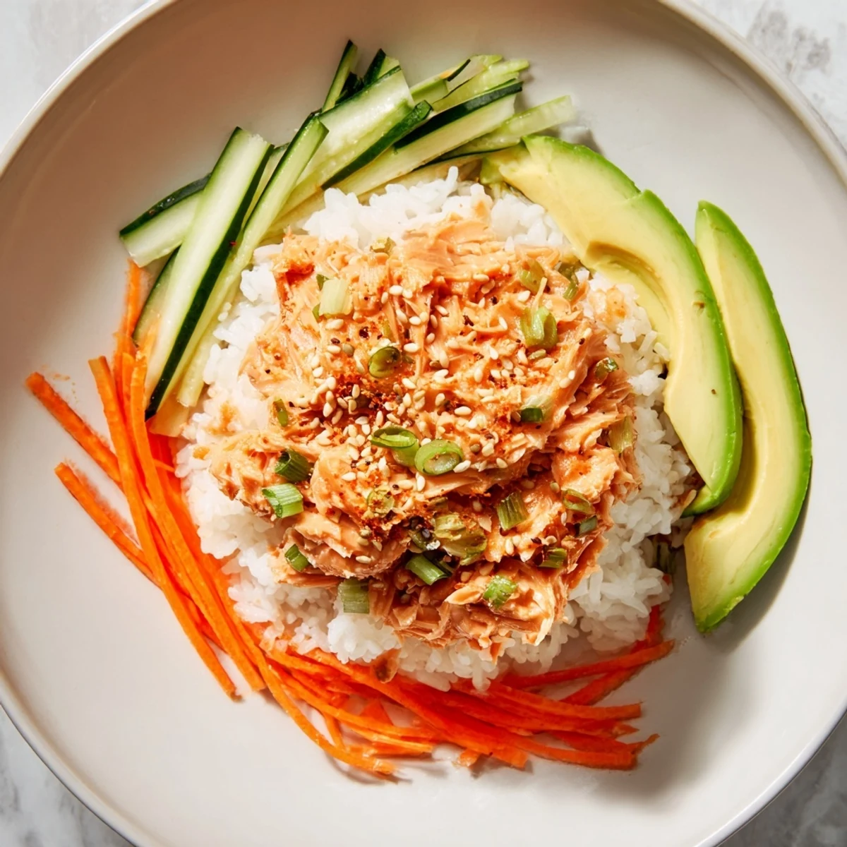 Steaming Spicy Canned Salmon Rice Bowl brimming with colorful veggies, ready to enjoy.