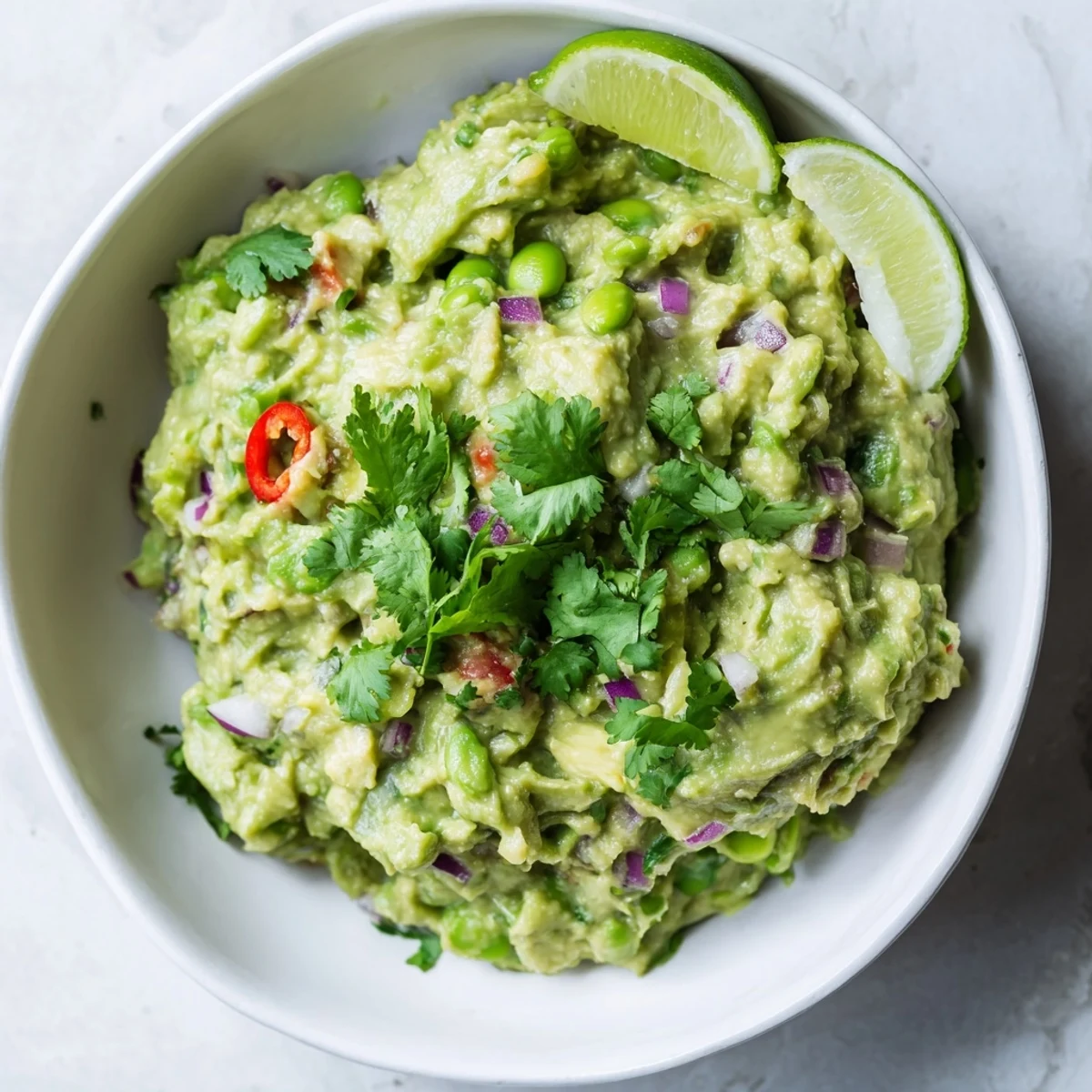 Creamy Edamame Guacamole, a vibrant green dip, served with crunchy tortilla chips, so flavorful.