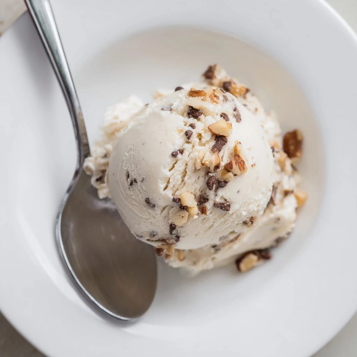 Smooth, creamy homemade Cottage Cheese Ice Cream, swirled with fresh berries, ready to serve and enjoy.