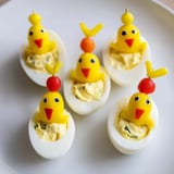 Savory Chick & Duckling Snacks, featuring carrot beaks and peppercorn eyes, perfect for a kids' party platter.