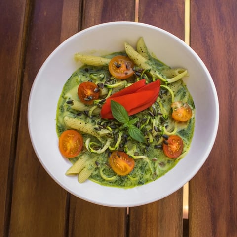 Creamy Vegan Green Goddess Pasta with blended spinach, herbs, and avocado, ready to serve and enjoy.