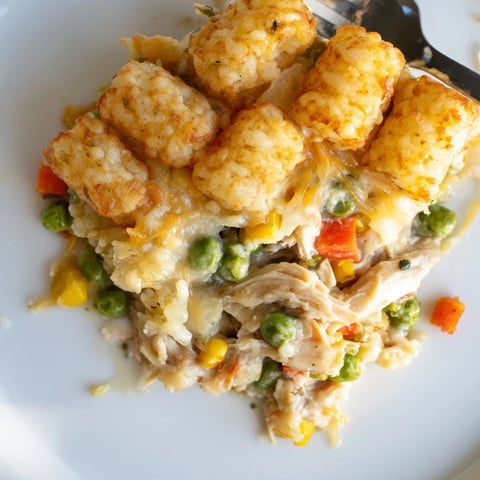 Golden, crispy tater tots crown a savory and steaming Tater Tot Chicken Pot Pie.