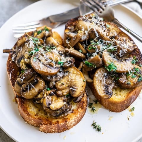 Close-up of mouthwatering Garlic Sautéed Mushroom Toast Sliders, ready for an easy appetizer.