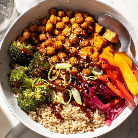 Hearty grain bowls featuring bold sauces, roasted vegetables, and savory chickpeas for ultimate satisfaction.  
