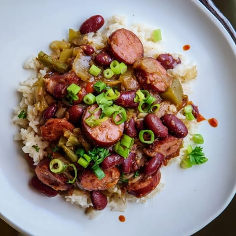 Savory red beans & rice simmered with smoky sausage, perfect for comfort food.  