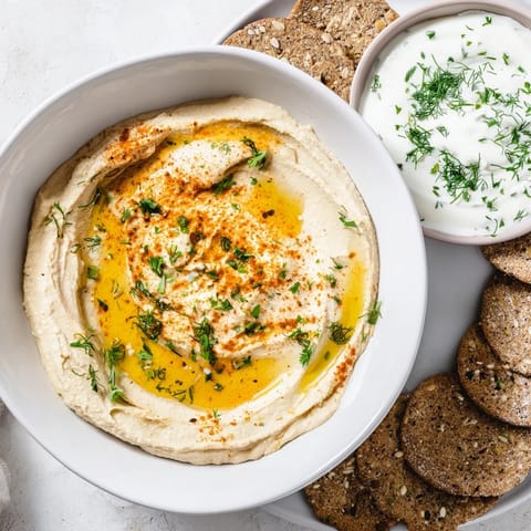 A perfect party appetizer with Easy Dips: close-up shot of the fresh dips and colorful garnishes ready to serve.