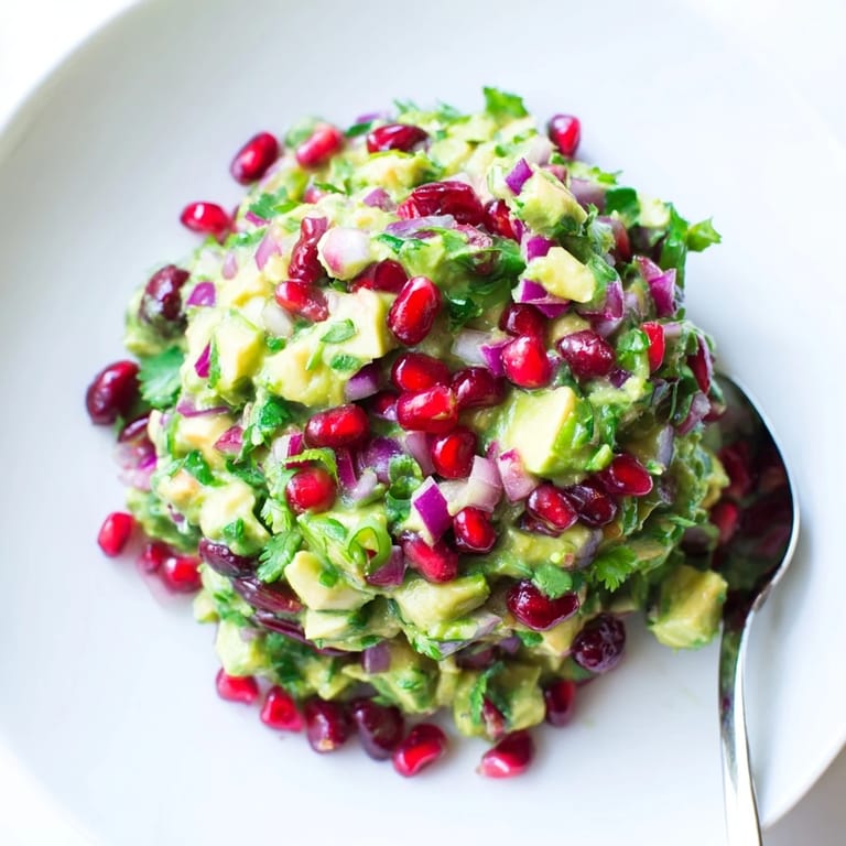 Creamy avocado mixed with sweet cranberries in flavorful jalapeño salsa dip.