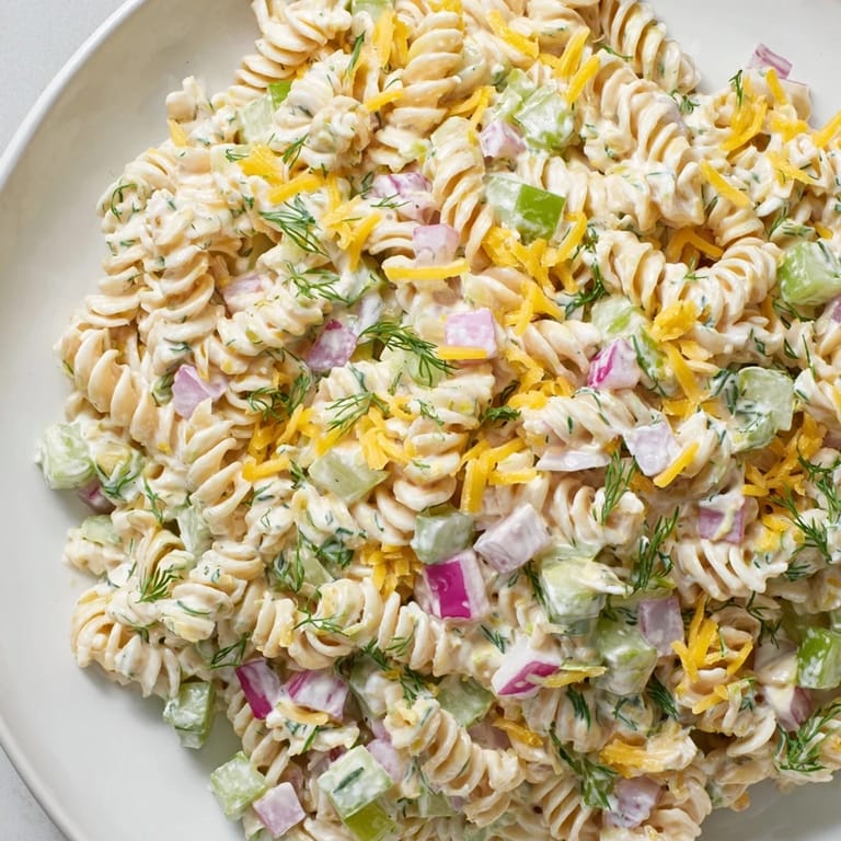 Cool, refreshing Dill Pickle Pasta Salad; a delicious vegetarian picnic salad with creamy dressing.